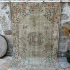 Beige 6' x 8' vintage distressed rug with medallion design, handmade in Turkey – Fitzroy.