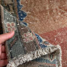 1970s orange vintage Turkish distressed rug with traditional design, hand-knotted weave and low pile.
