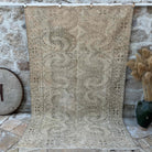 Beige 6' x 9' vintage distressed rug with neutral design, handmade in Turkey – Wayland.