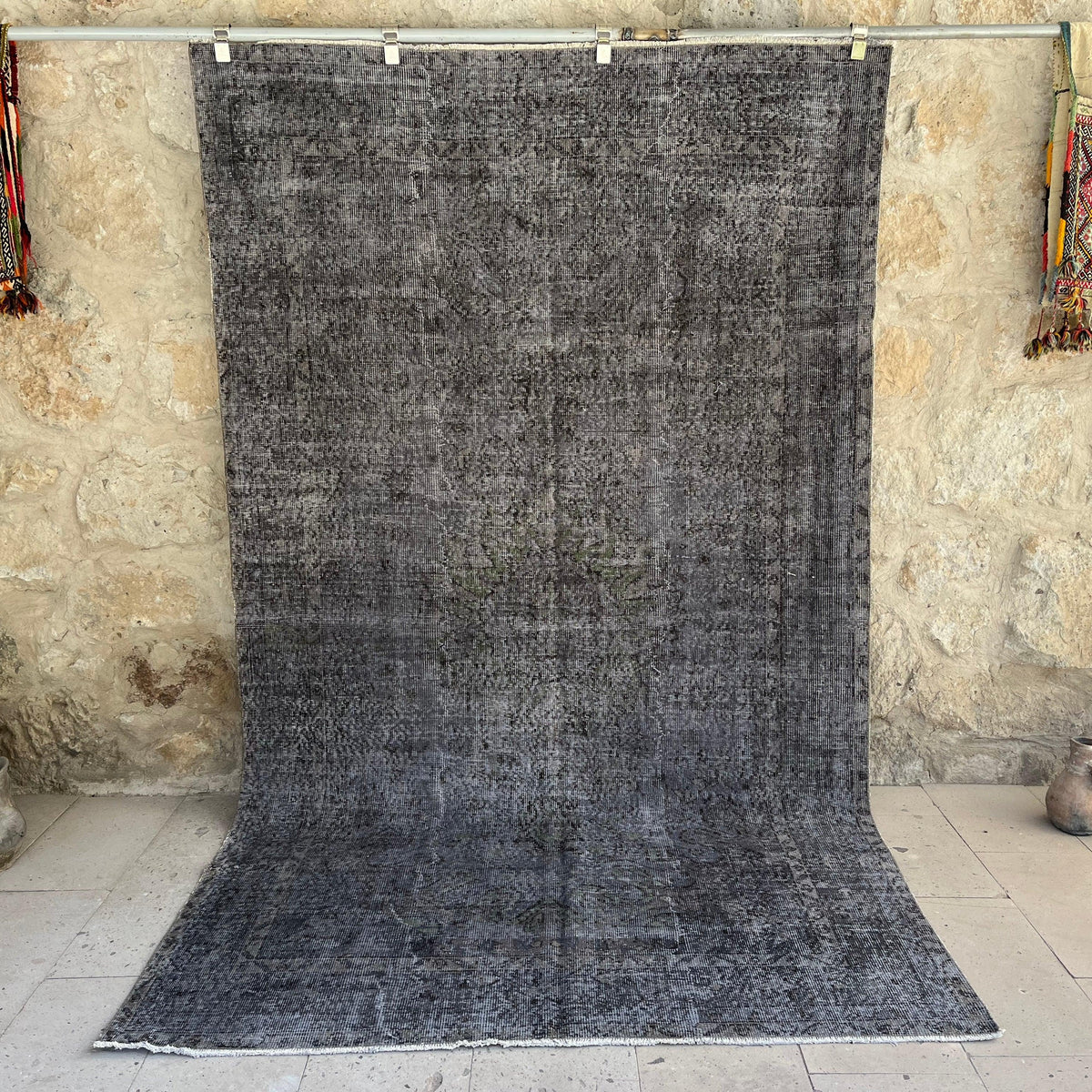 Black 6' x 9' vintage distressed rug with overdyed design, handmade in Turkey – Calvin.