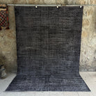 Black 6' x 9' vintage distressed rug with overdyed design, handmade in Turkey – Grover.