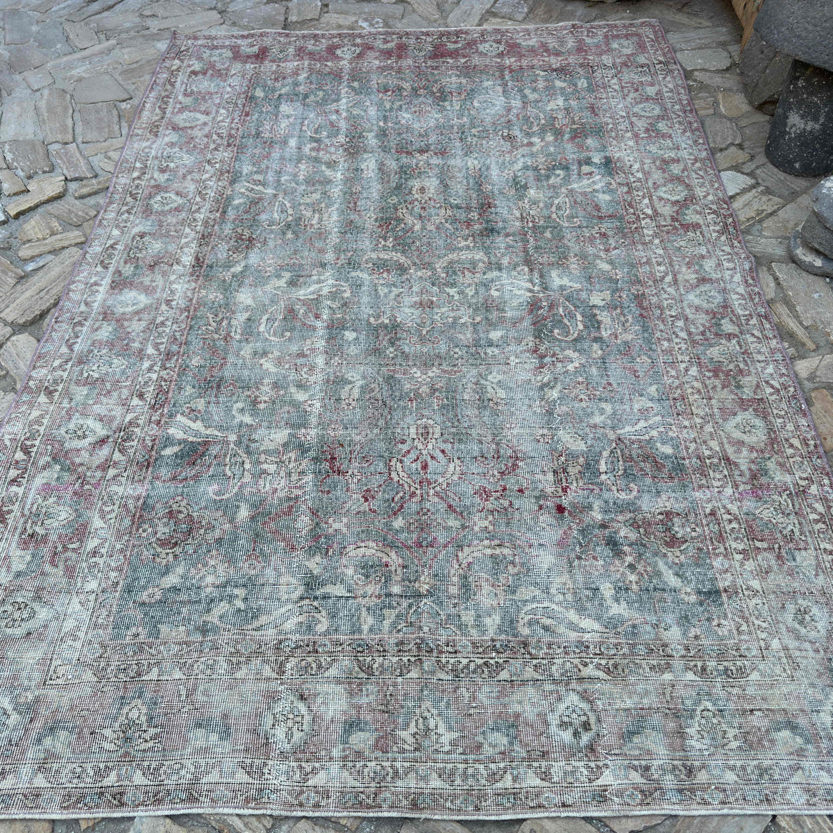 Pale Green 7' x 10' vintage Turkish distressed rug in wool and cotton, shown on the floor.