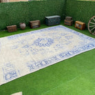 Blue 9' x 12' vintage distressed rug with medallion design, handmade in Turkey – Sennett.