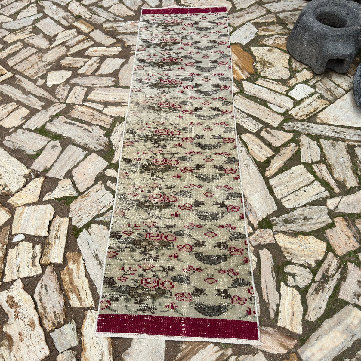 Green 2' x 8' vintage Turkish distressed runner rug in wool and cotton, shown on the floor.