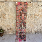 Orange 2' x 8' vintage distressed runner rug with traditional design, handmade in Turkey – Anson.