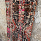 1970s orange vintage Turkish distressed runner rug with traditional design, hand-knotted weave and low pile.