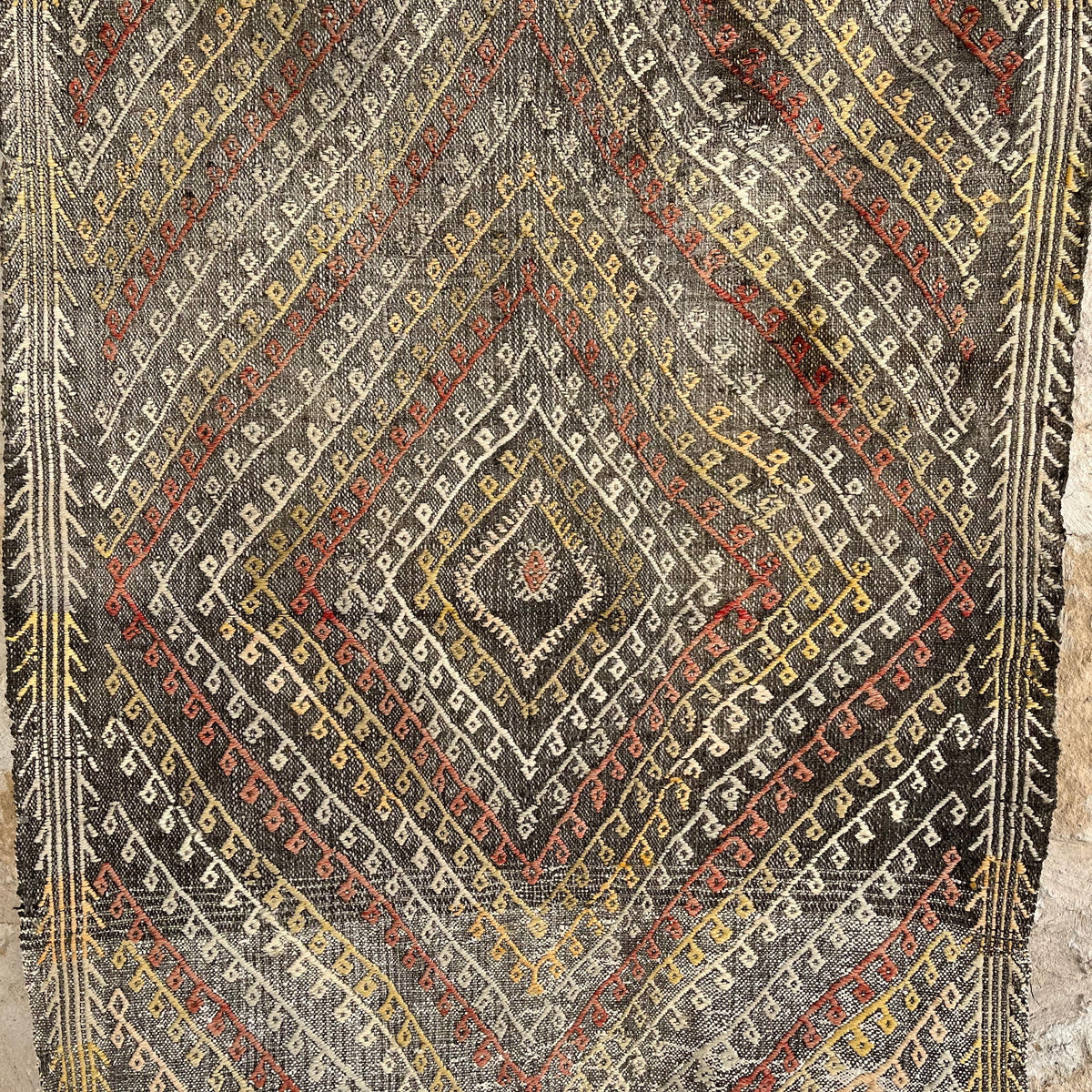 Black 3' x 4' vintage Turkish flatweave rug in wool and cotton, shown on the floor.