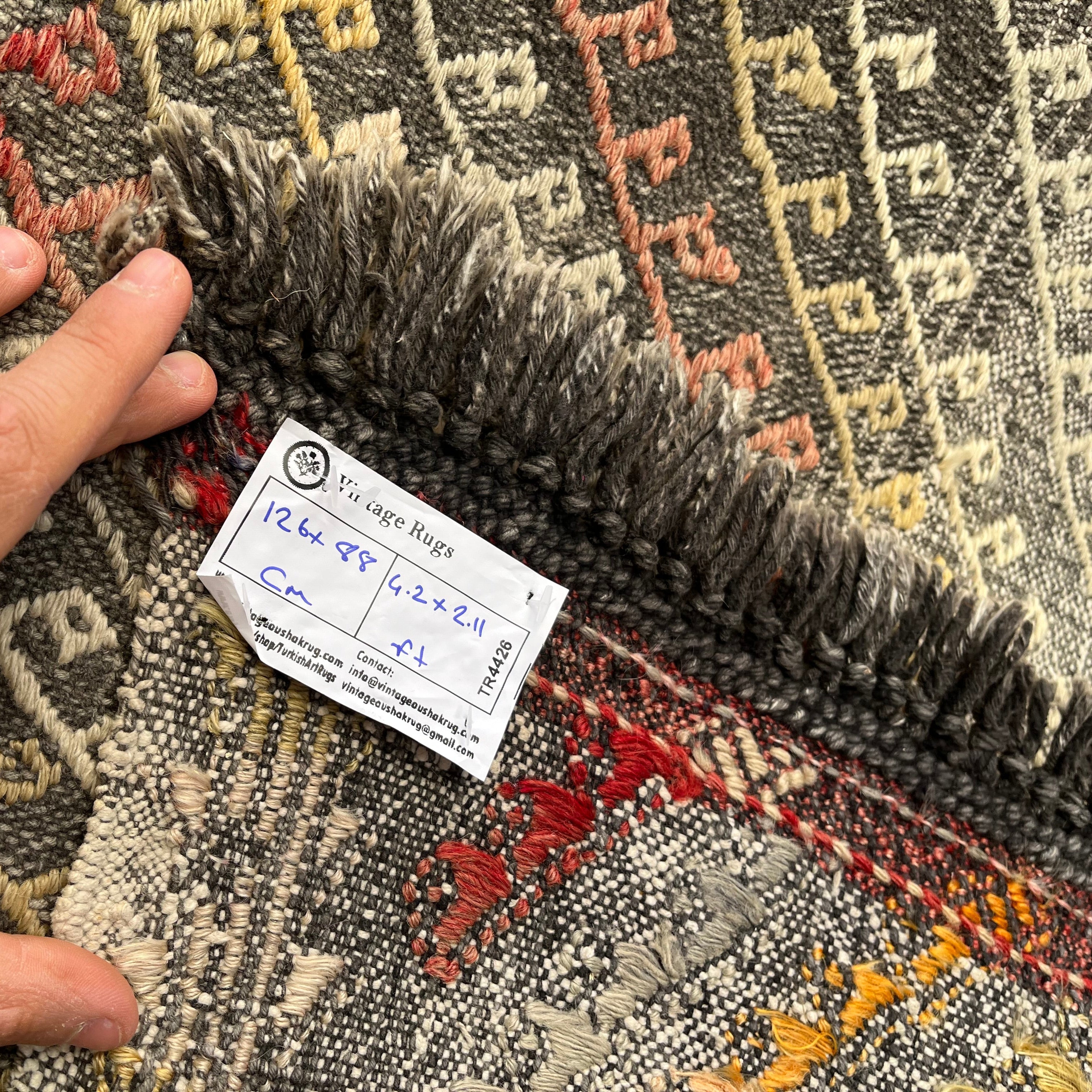 1970s black vintage Turkish flatweave rug with traditional design, flatweave construction and low pile.
