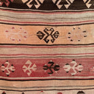 Close-up of the red vintage Turkish flatweave rug showing traditional details, flatweave construction, wool and cotton and low pile.