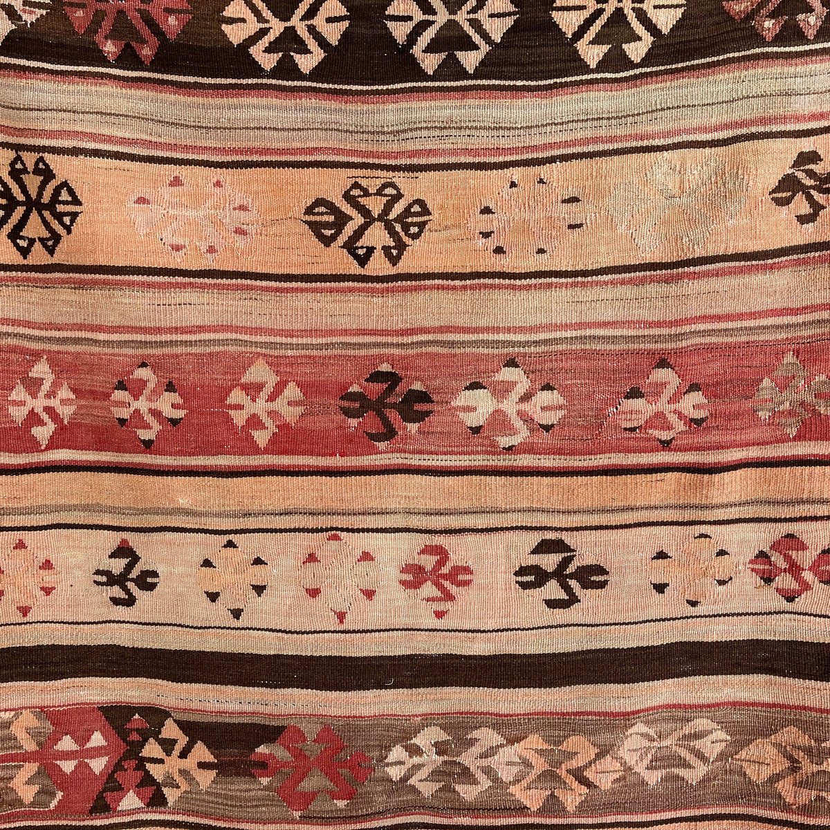Red 3' x 4' vintage Turkish flatweave rug in wool and cotton, shown on the floor.