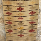 Beige 2' x 8' vintage Turkish flatweave runner rug in wool and cotton, shown on the floor.