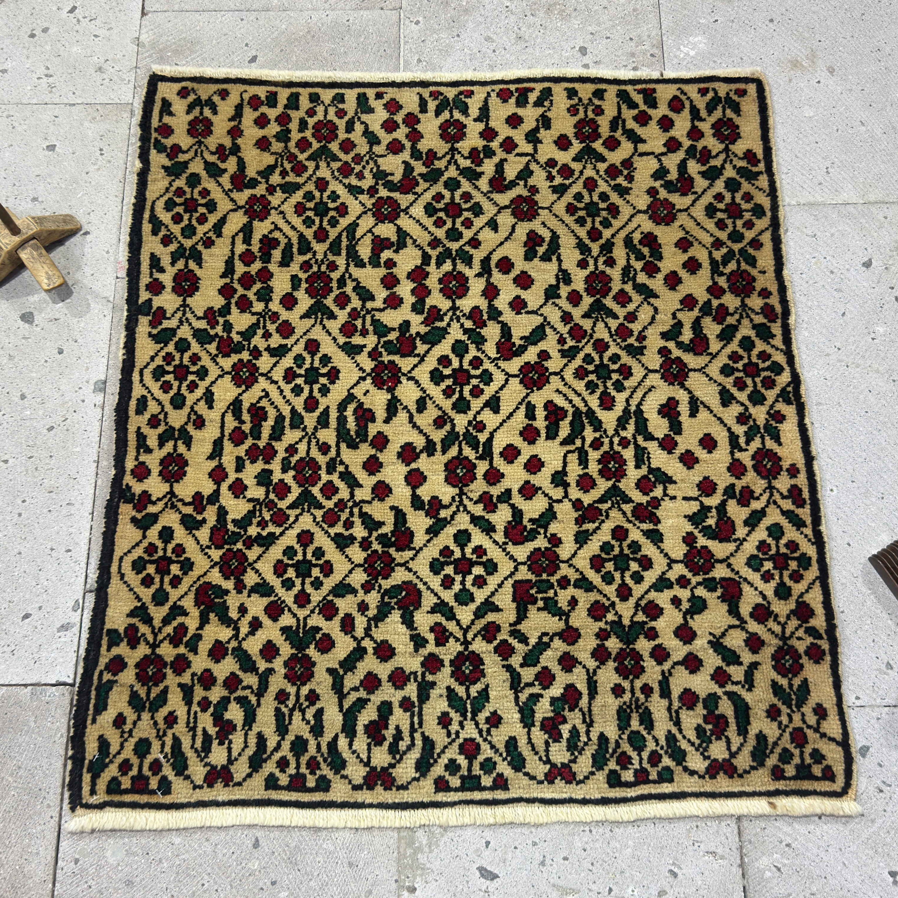 Red 2' x 3' vintage Turkish floral rug in wool and cotton, shown on the floor.