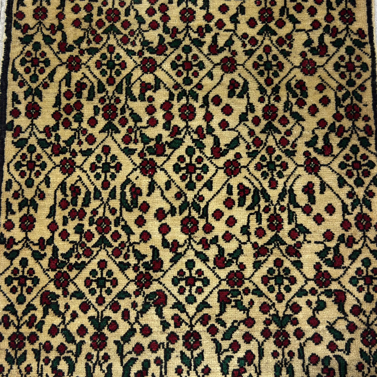 1970s red vintage Turkish floral rug with floral design, hand-knotted weave and low pile.