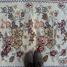 1970s red vintage Turkish floral rug with floral design, hand-knotted weave and low pile.