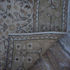 1970s beige vintage Turkish floral rug with floral design, hand-knotted weave and low pile.