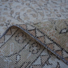 Additional view of the beige vintage Turkish floral rug, hand-knotted in wool and cotton.