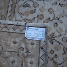 Beige 4' x 7' vintage Turkish floral rug from the 1970s with floral design.