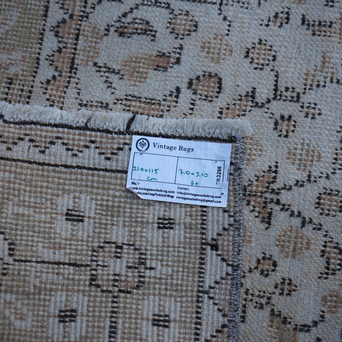 Beige 4' x 7' vintage Turkish floral rug from the 1970s with floral design.