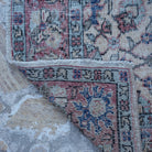 1970s red vintage Turkish floral rug with floral design, hand-knotted weave and low pile.