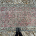 1970s pink vintage Turkish floral rug with floral design, hand-knotted weave and low pile.