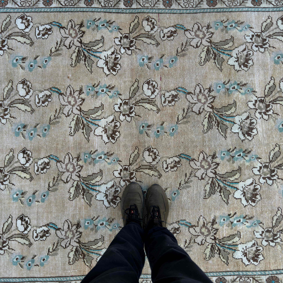 1970s beige vintage Turkish floral rug with floral design, hand-knotted weave and low pile.