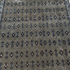 Brown 5' x 7' vintage Turkish floral rug in wool and cotton, shown on the floor.