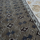 1970s brown vintage Turkish floral rug with floral design, hand-knotted weave and low pile.