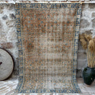 Orange 5' x 8' vintage floral rug with floral design, handmade in Turkey – Jessi.