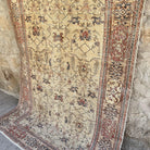 Pale Red 5' x 8' vintage Turkish floral rug in wool and cotton, shown on the floor.