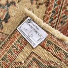 1970s pale red vintage Turkish floral rug with floral design, hand-knotted weave and low pile.