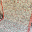 Pale Green 7' x 11' vintage Turkish floral rug in wool and cotton, shown on the floor.