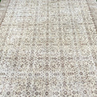 1970s brown vintage Turkish floral rug with floral design, hand-knotted weave and low pile.