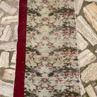 1970s beige vintage Turkish floral runner rug with traditional design, hand-knotted weave and low pile.