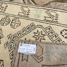 Close-up of the pale blue vintage Turkish floral runner rug showing traditional details, hand-knotted weave, wool and cotton and low pile.