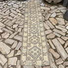 Pale Blue 2' x 8' vintage Turkish floral runner rug in wool and cotton, shown on the floor.