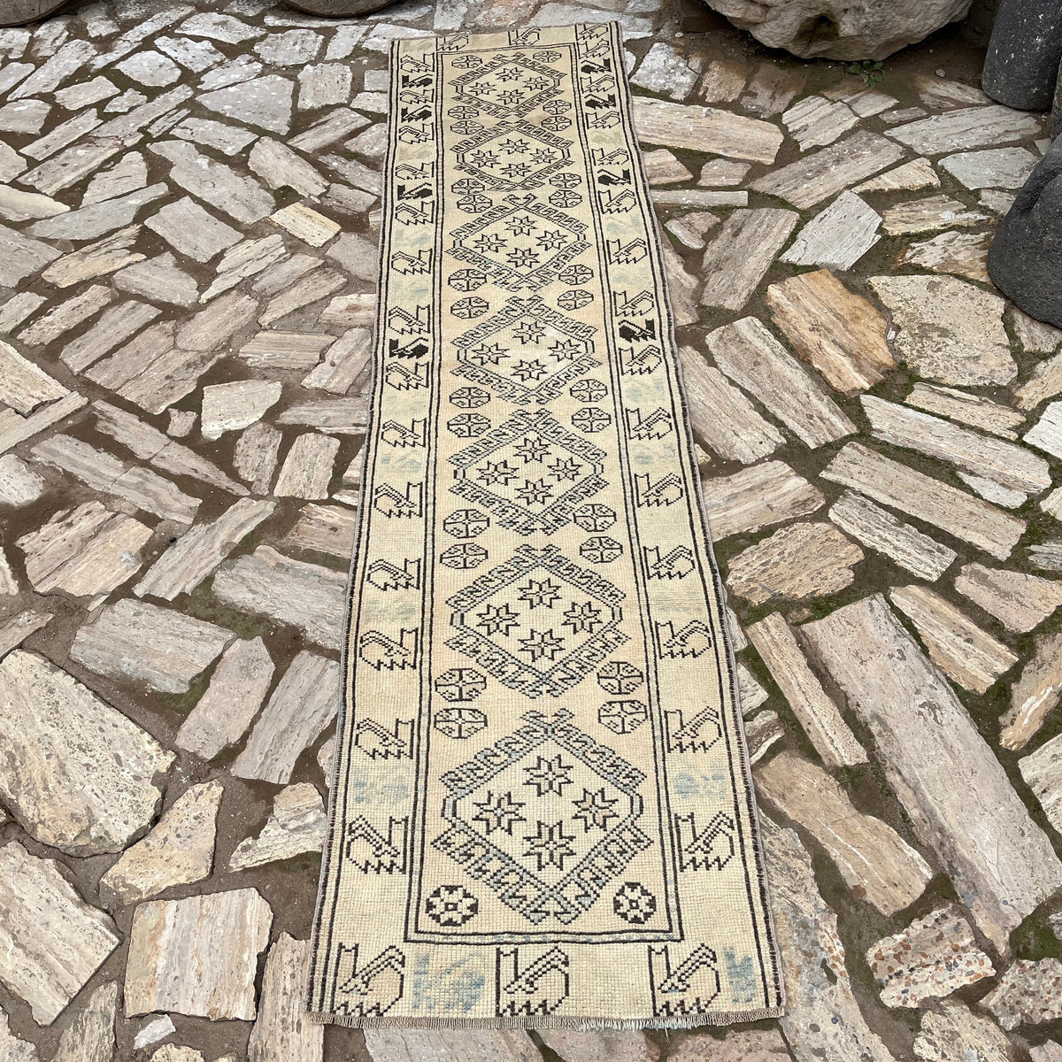 Pale Blue 2' x 8' vintage Turkish floral runner rug in wool and cotton, shown on the floor.