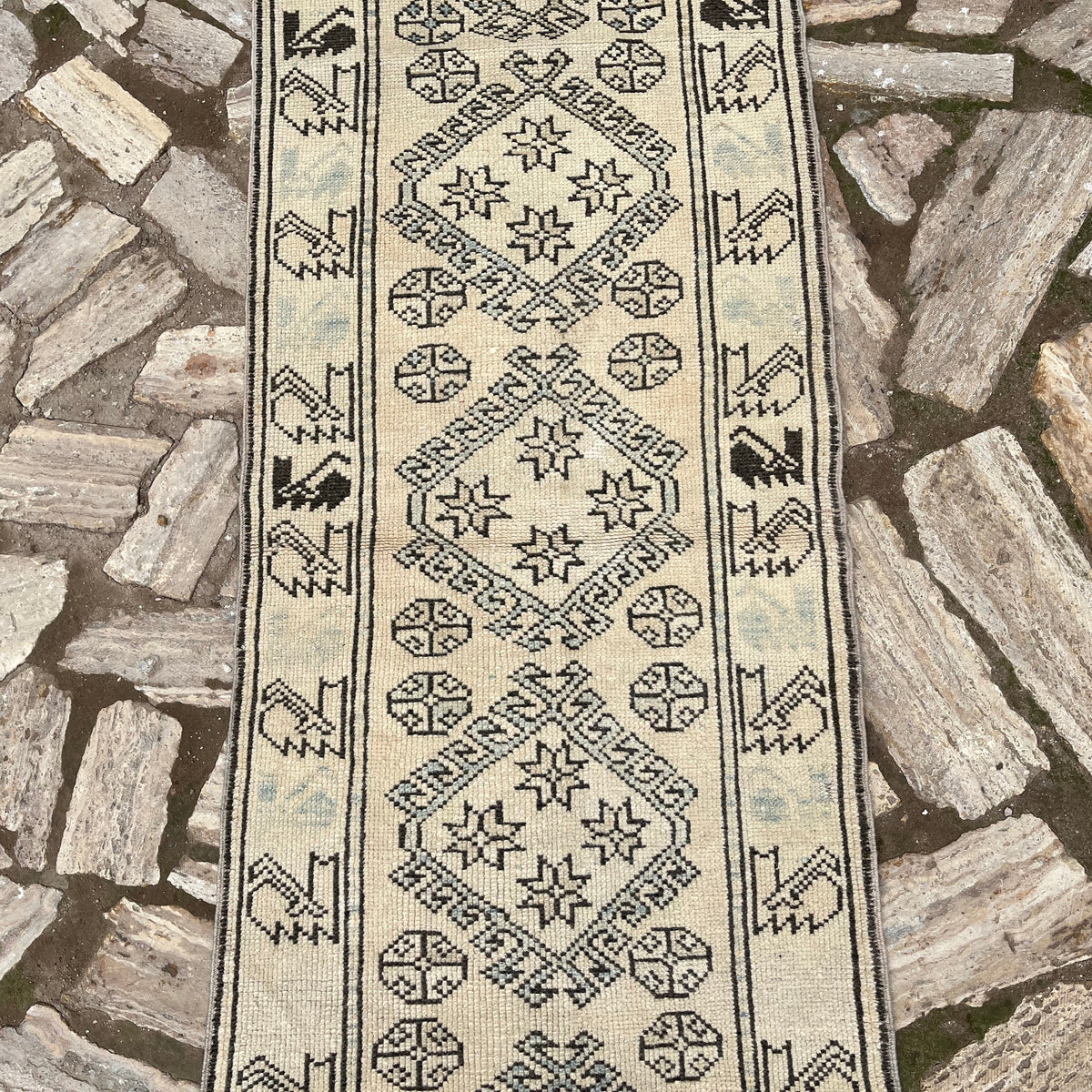 1970s pale blue vintage Turkish floral runner rug with traditional design, hand-knotted weave and low pile.