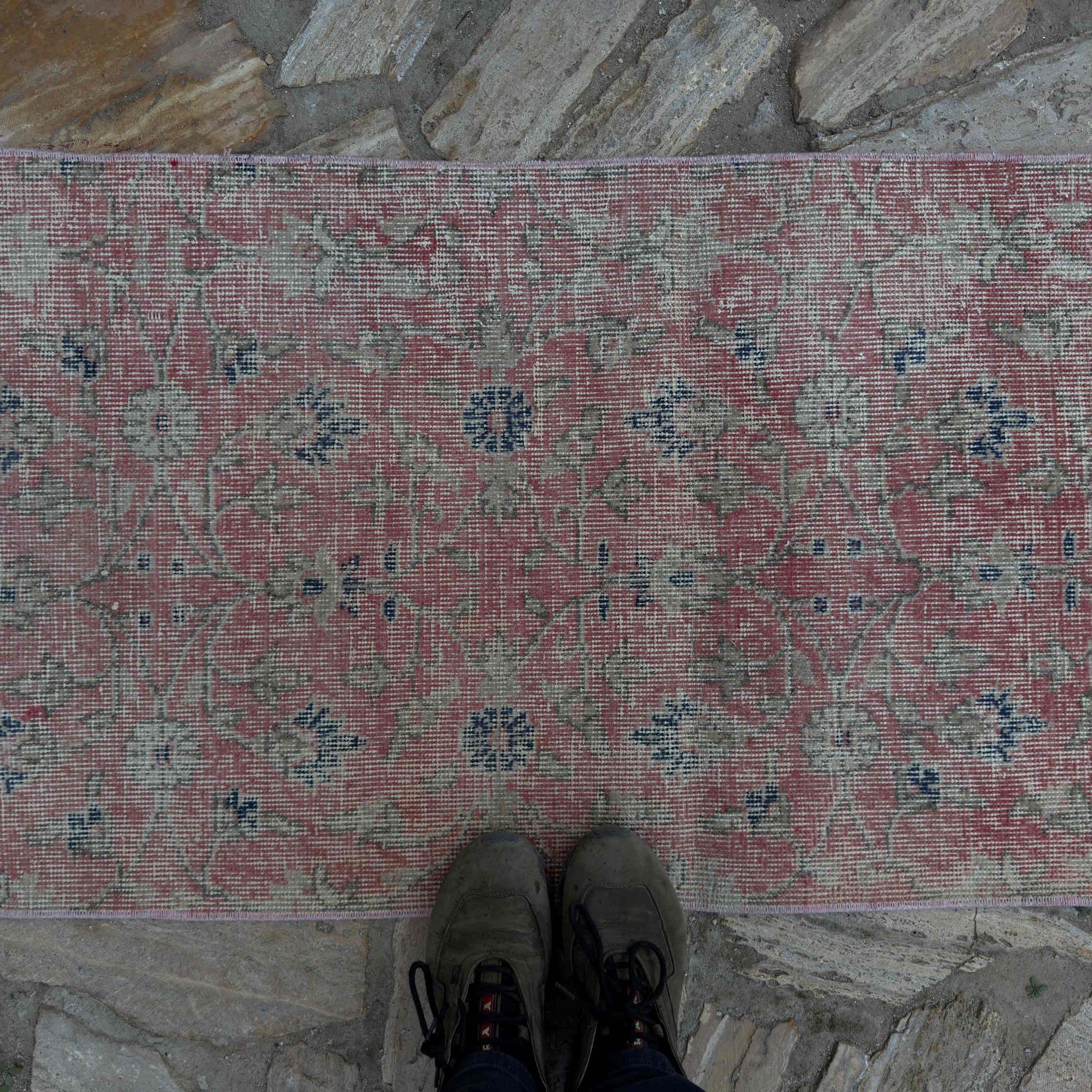 1970s pale red vintage Turkish floral runner rug with floral design, hand-knotted weave and low pile.