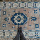 1970s pale blue vintage Turkish geometric carpet with medallion design, hand-knotted weave and low pile.