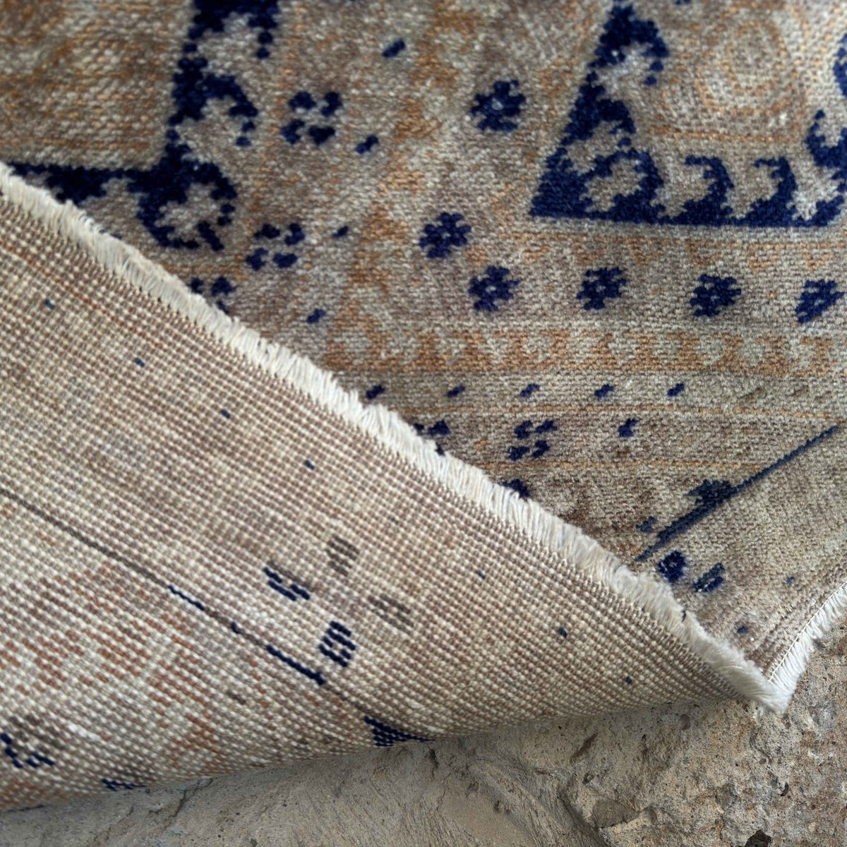 Blue 3' x 6' vintage geometric rug in wool and cotton, shown on the floor.