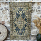 Blue 4' x 6' vintage geometric rug with medallion design, handmade in Turkey – Blakeley.