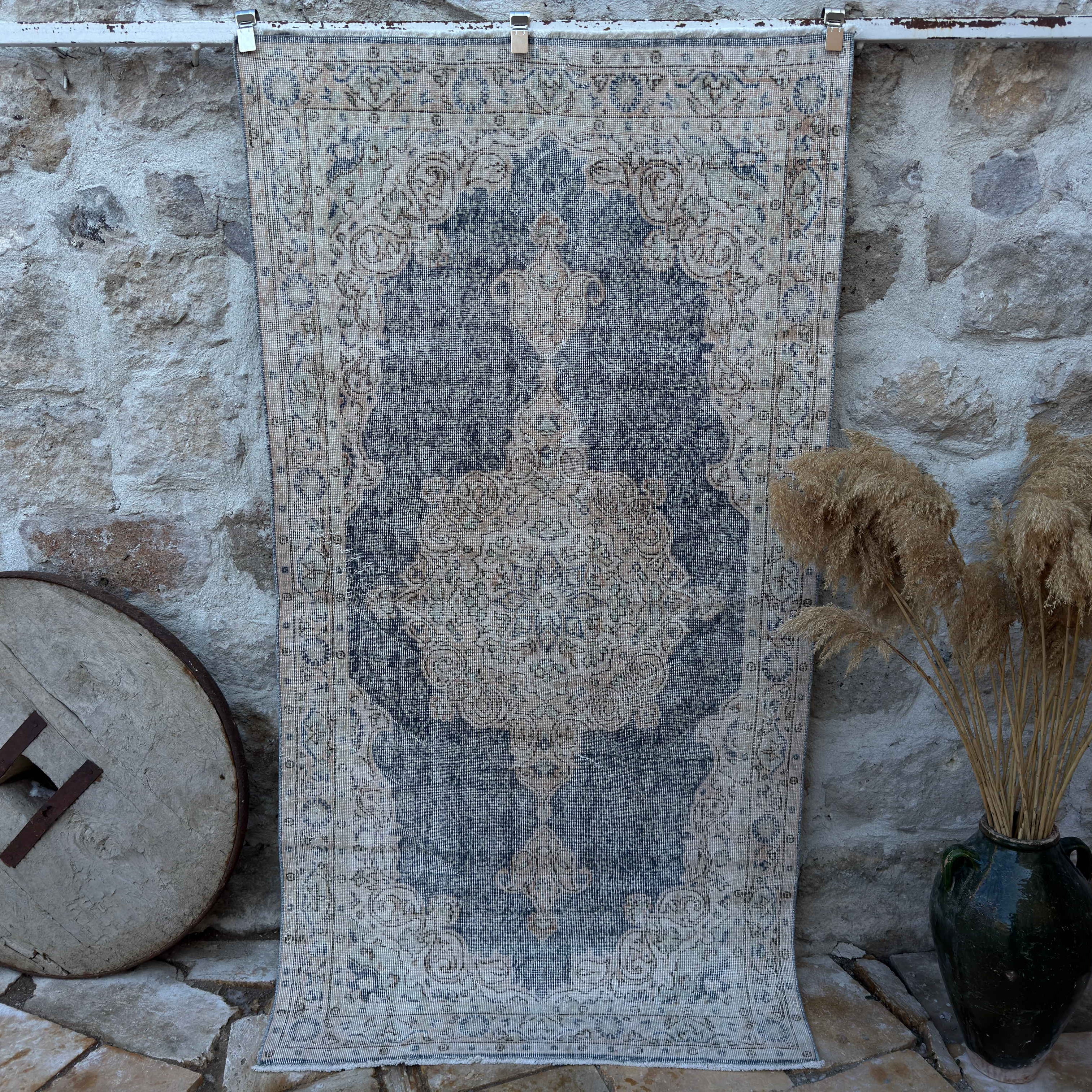 Blue 4' x 7' vintage geometric rug with medallion design, handmade in Turkey – Kylen.