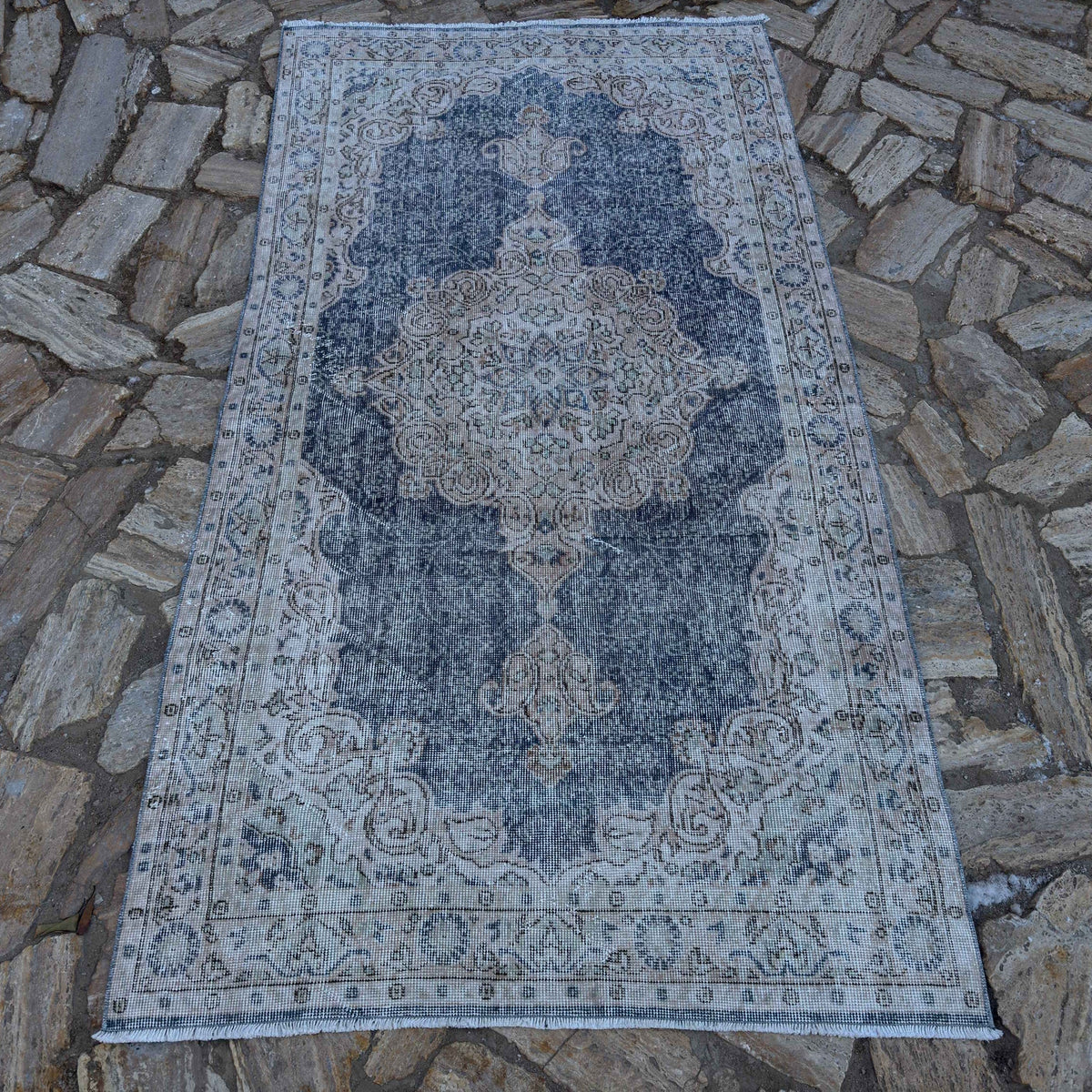 Blue 4' x 7' vintage Turkish geometric rug in wool and cotton, shown on the floor.