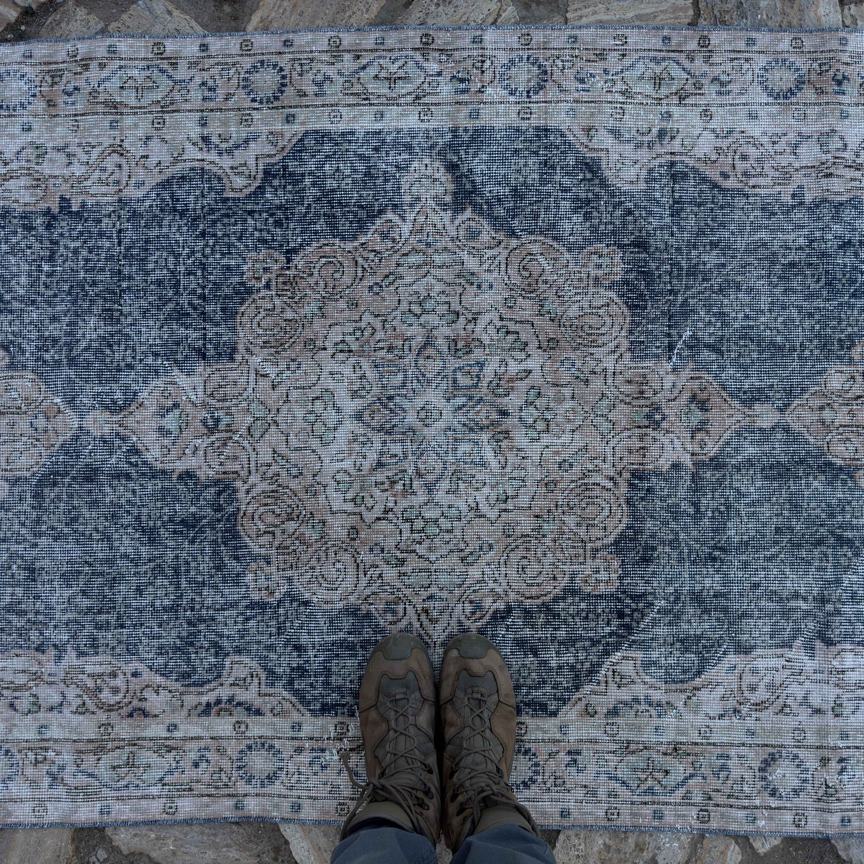 1970s blue vintage Turkish geometric rug with medallion design, hand-knotted weave and low pile.