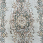 1970s pale green vintage Turkish geometric rug with medallion design, hand-knotted weave and low pile.