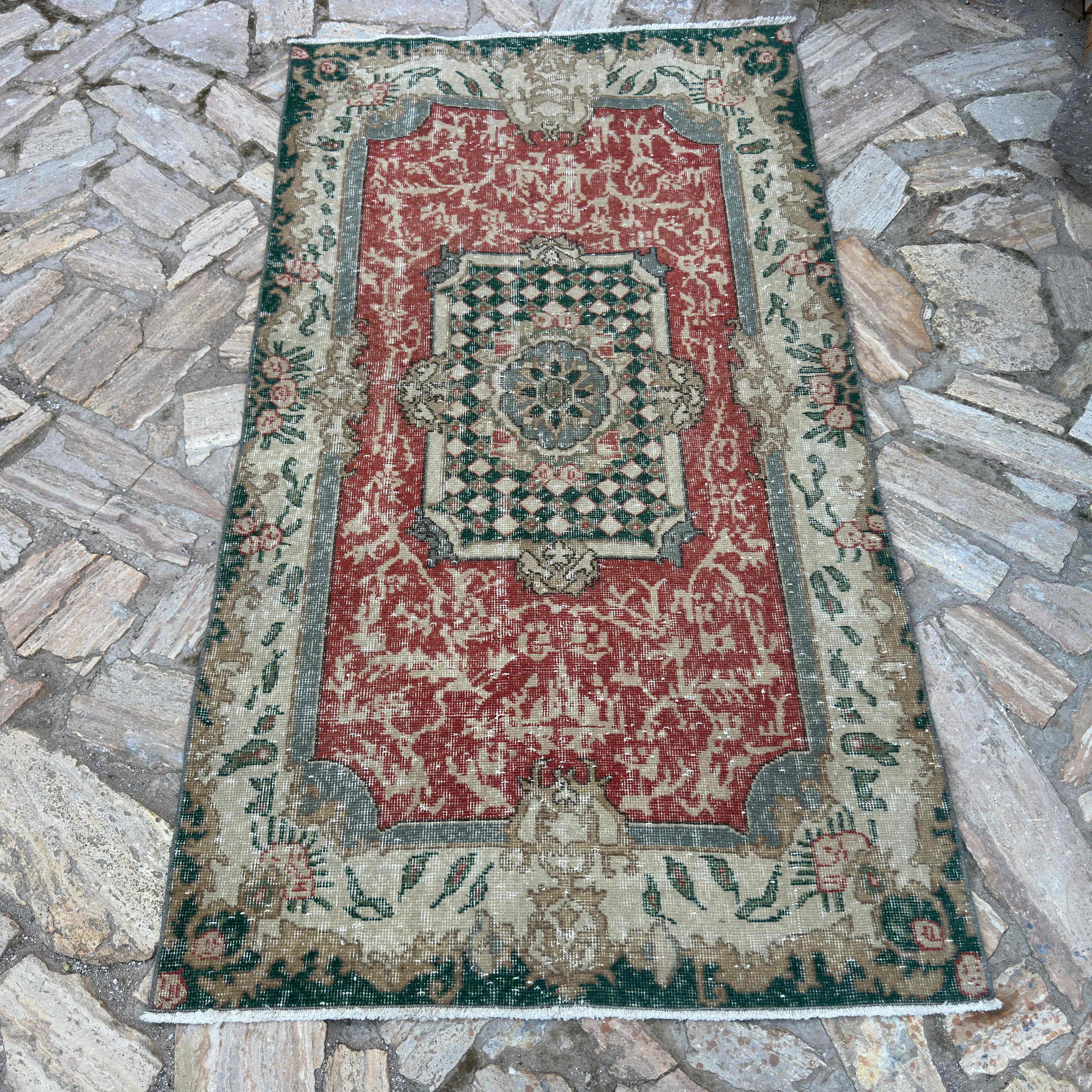 Red 4' x 7' vintage Turkish geometric rug in wool and cotton, shown on the floor.