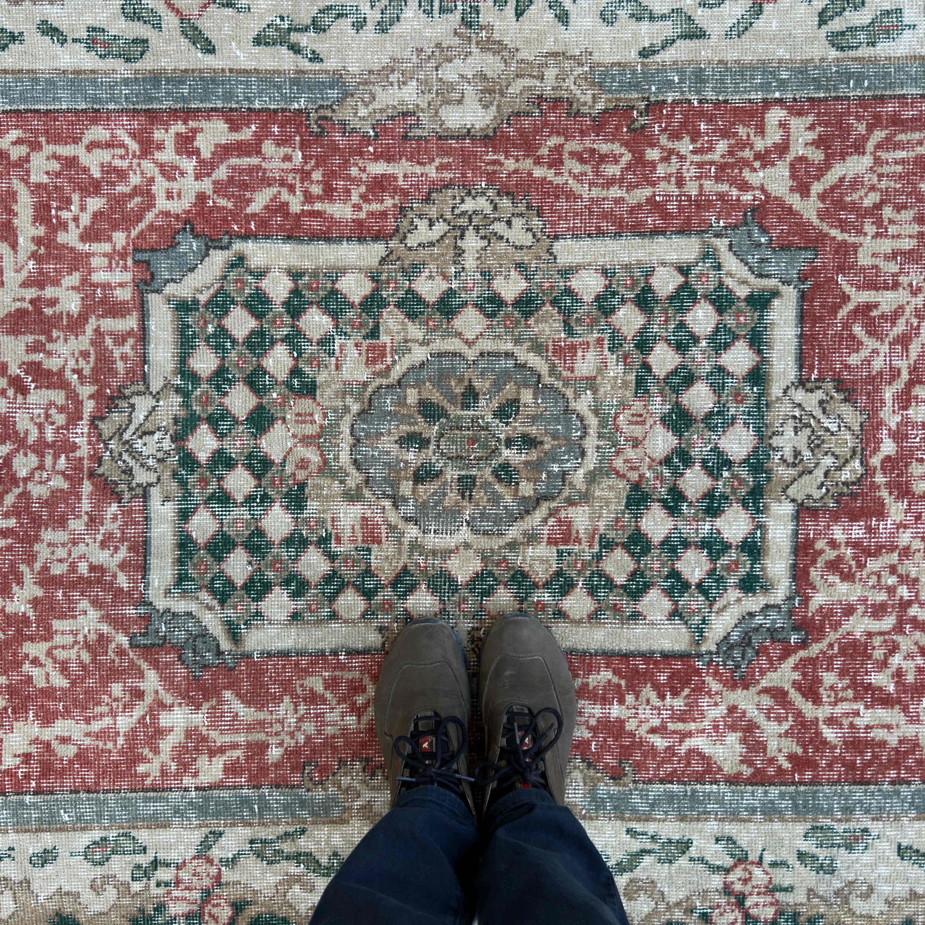 1970s red vintage Turkish geometric rug with traditional design, hand-knotted weave and low pile.