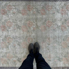 1970s beige vintage Turkish geometric rug with floral design, hand-knotted weave and low pile.