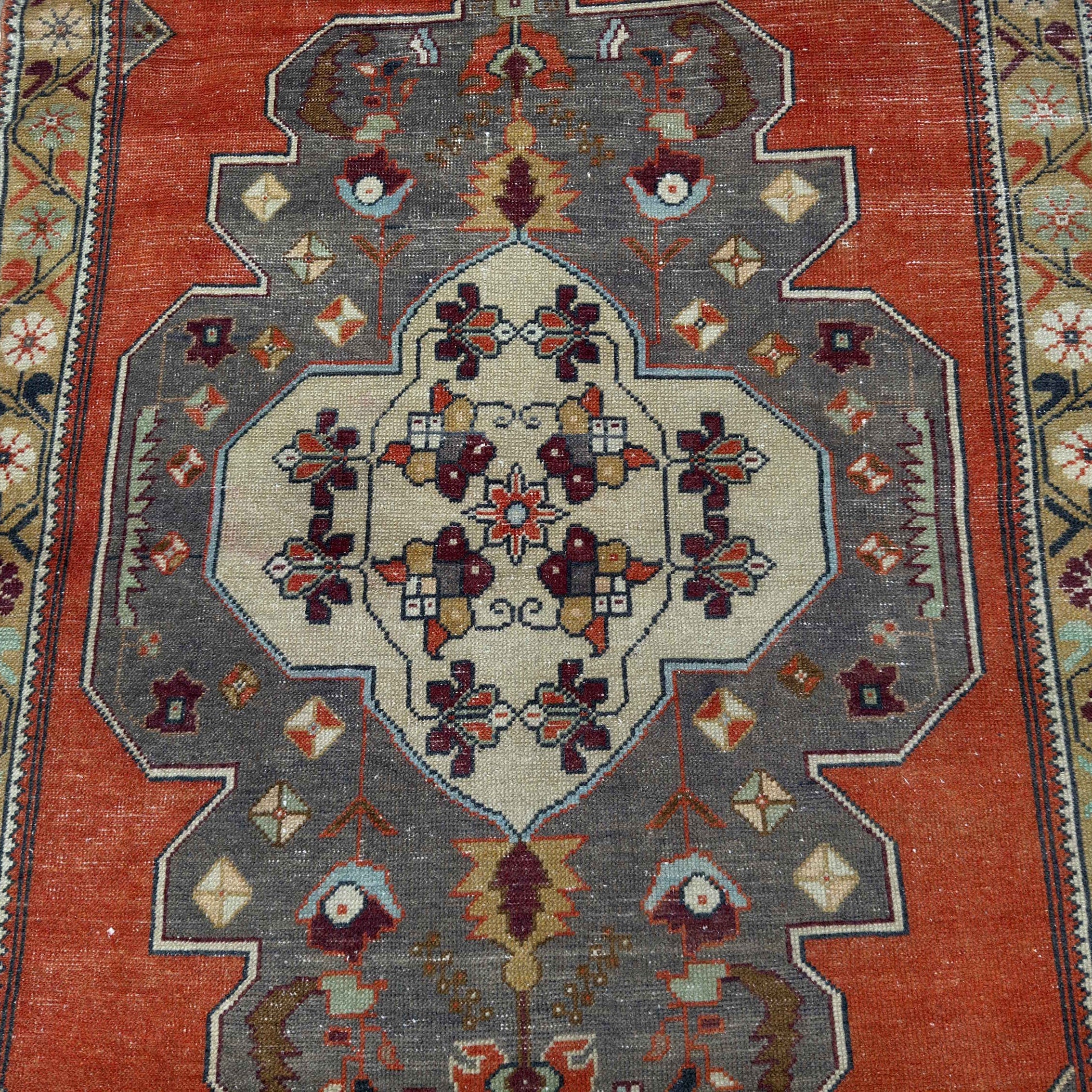 1970s orange vintage Turkish geometric rug with traditional design, hand-knotted weave and low pile.
