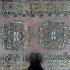 1970s pink vintage Turkish geometric rug with traditional design, hand-knotted weave and low pile.